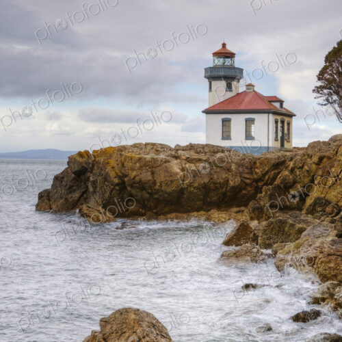Lighthouse overlooking rocky coastline