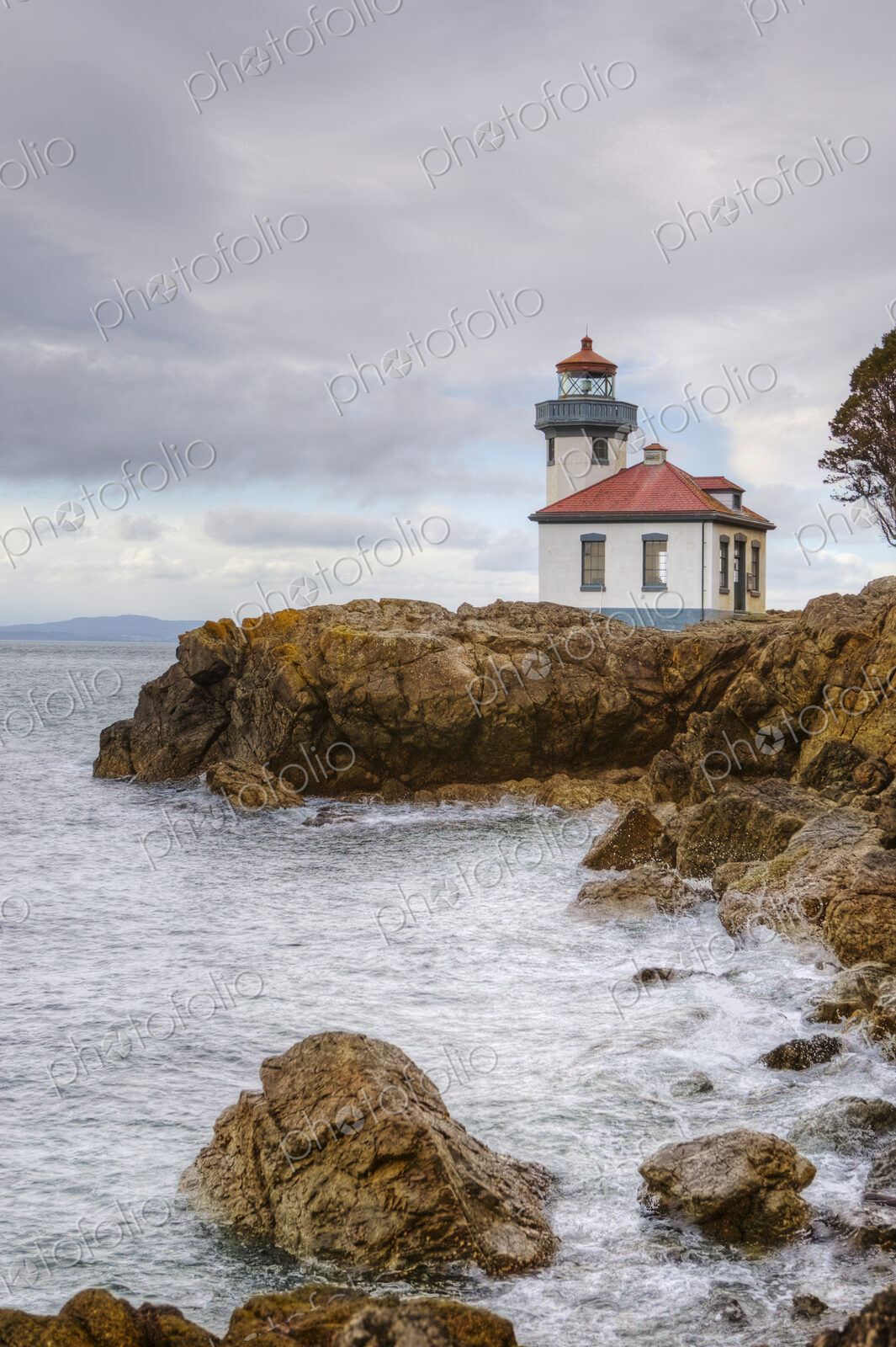 Lighthouse overlooking rocky coastline