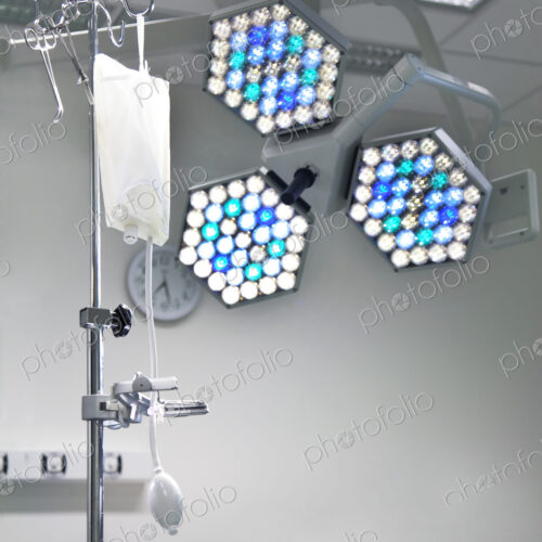 Lighting rig and lights over the table in an operating theatre.