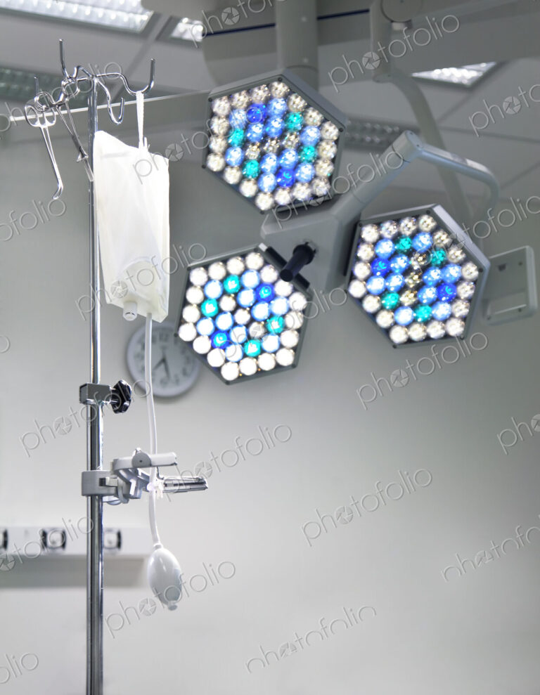 Lighting rig and lights over the table in an operating theatre.