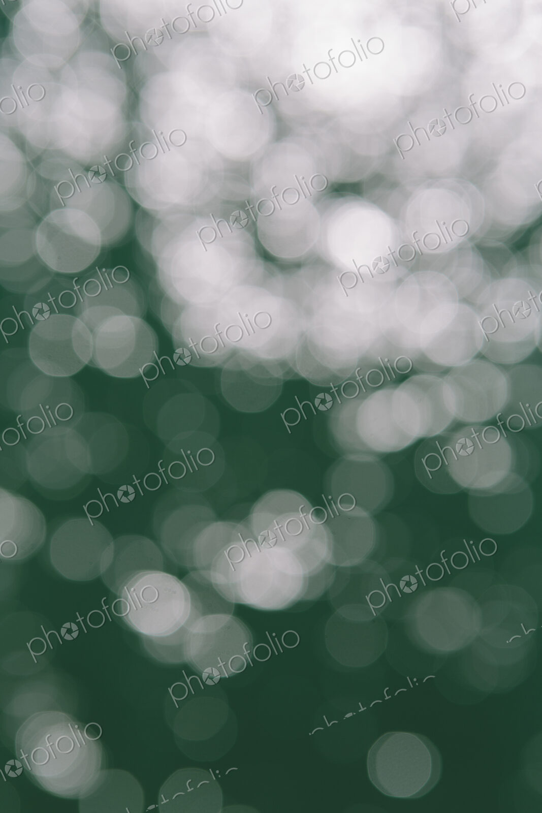 Lights reflecting off the water surface, on the Pacific ocean at Big Sur, California.