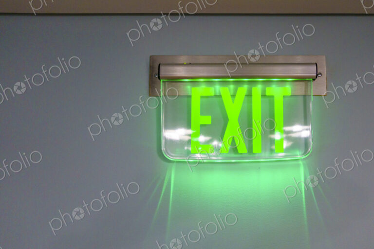 Lit exit sign on a wall