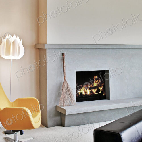 Living room in a modern house, chairs and fireplace Living room in a modern house, chairs and fireplace