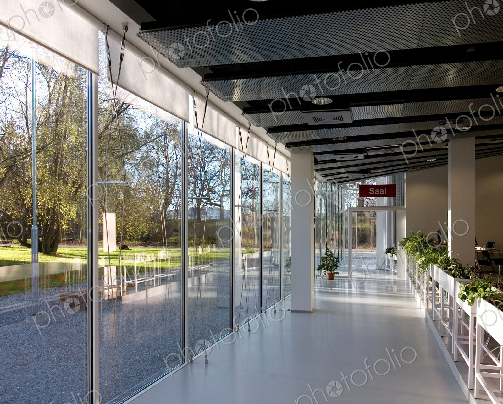 Lobby of hotel or conference centre with glass walls.