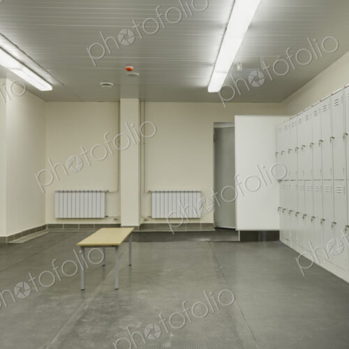 Locker room with rubber mats on floor. Locker room with rubber mats on floor.