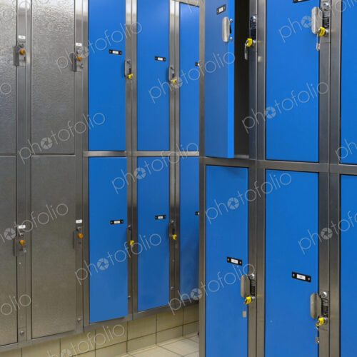 Lockers with blue doors for rent in a public locker room at a recreation centre. Lockers with blue doors for rent in a public locker room at a recreation centre.