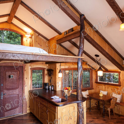 Loft bedroom in wooden tree house Loft bedroom in wooden tree house