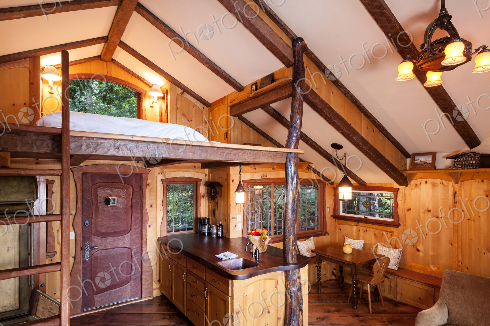 Loft bedroom in wooden tree house