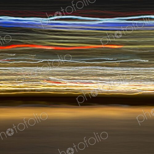 Long exposure abstract of Portland, Oregon skyline with colorful streaks of city…