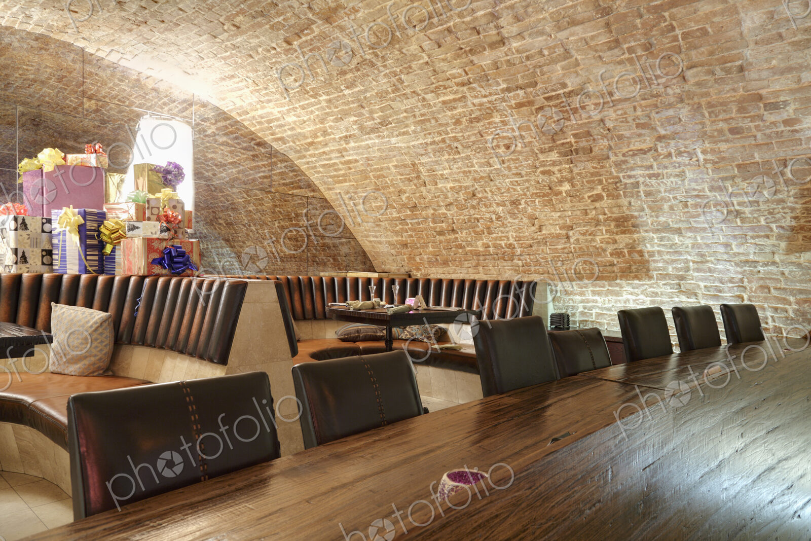 Long wooden table in sports bar.