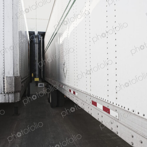 Lorries docked at a warehouse.