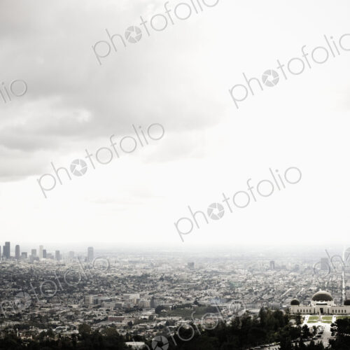 Los Angeles Skyline and Griffith Observatory Beneath Cloudy Sky Los Angeles Skyline and Griffith Observatory Beneath Cloudy Sky