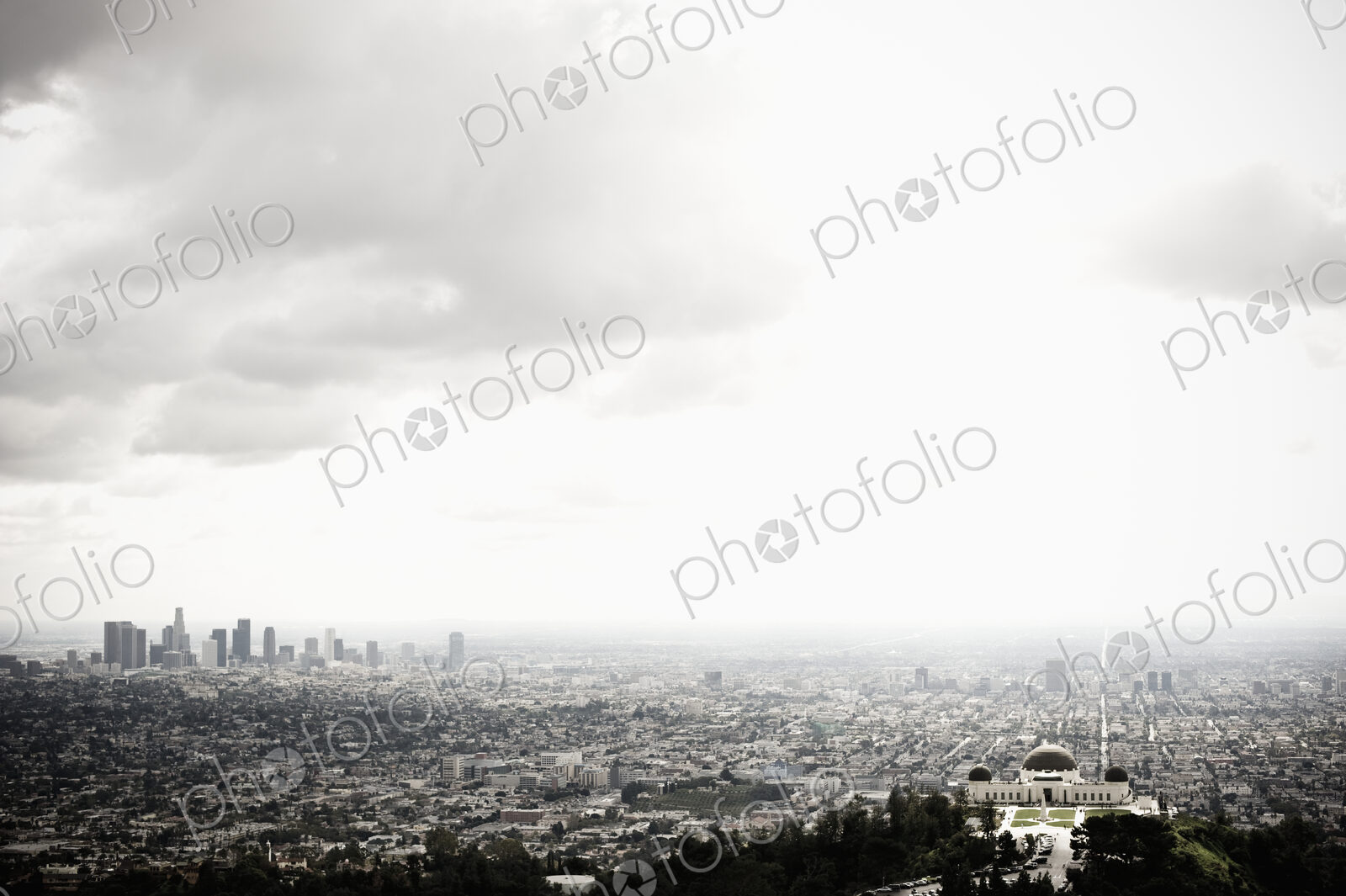 Los Angeles Skyline and Griffith Observatory Beneath Cloudy Sky