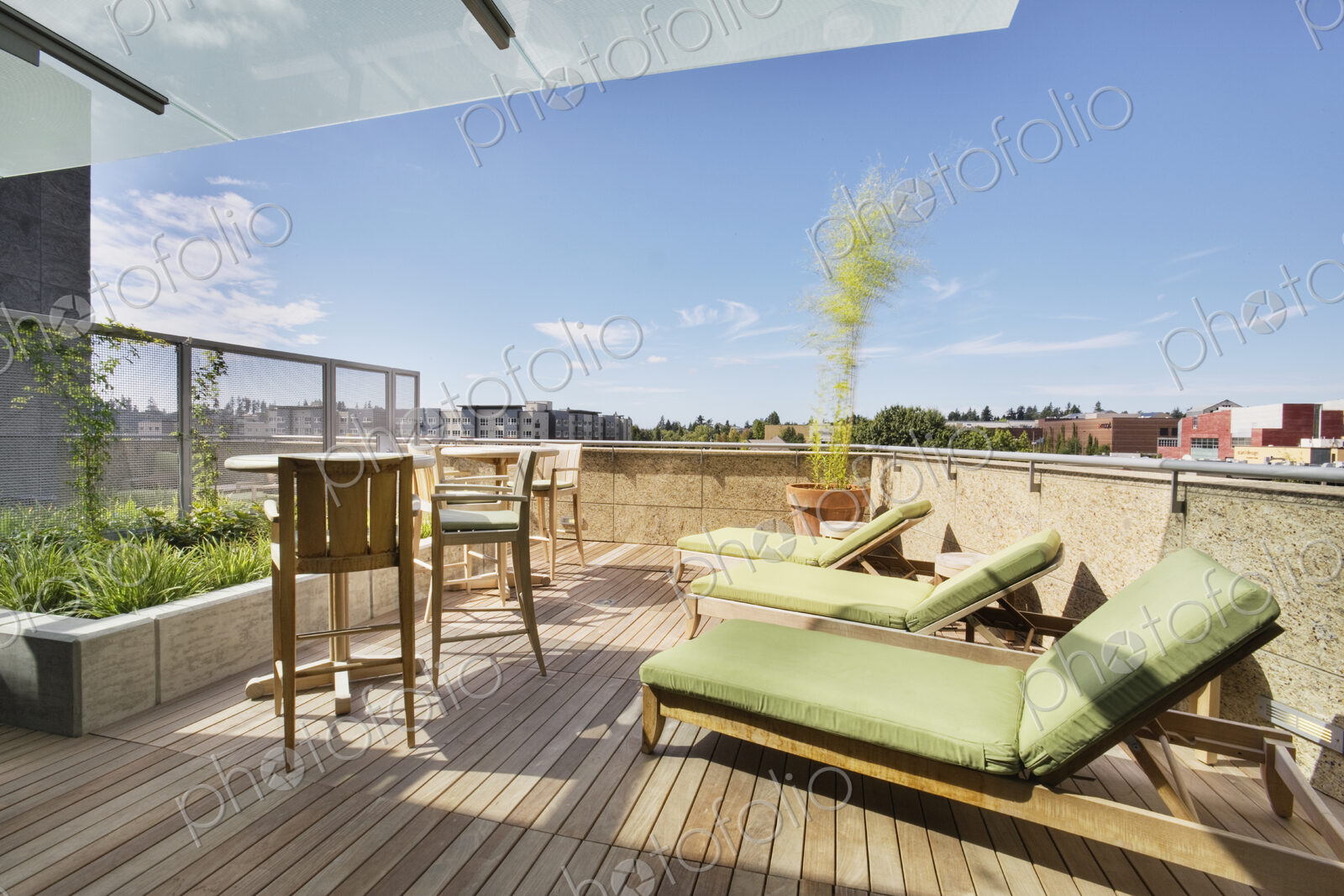 Lounge chairs on rooftop balcony