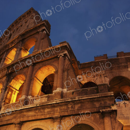 Low angel view of the Colosseum in Rome at dusk. Low angel view of the Colosseum in Rome at dusk.