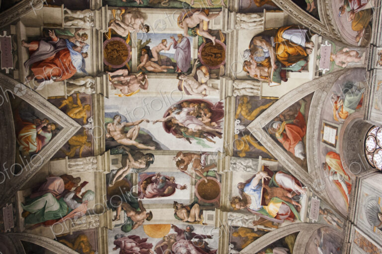 Low angle interior view of Michelangelo's ceiling in the Sistine Chapel in Vatican…