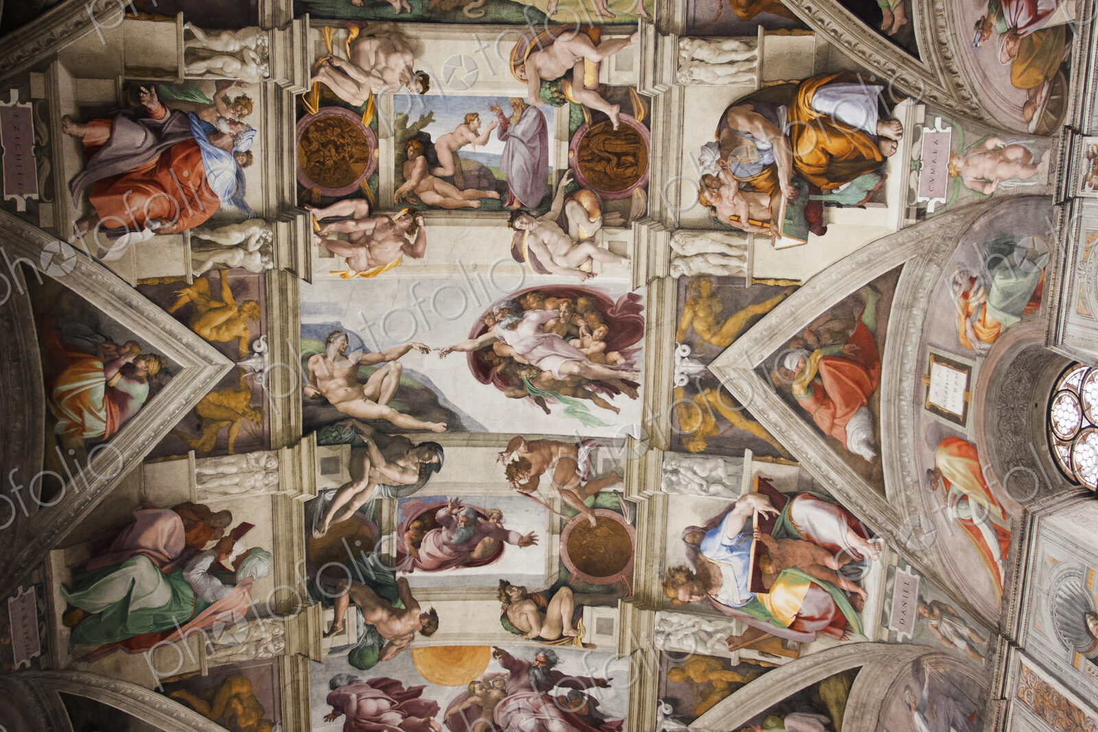 Low angle interior view of Michelangelo’s ceiling in the Sistine Chapel in Vatican…