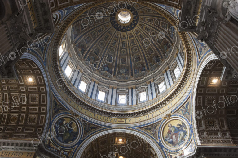Low angle interior view of the dome of St. Peter's Basilica in Vatican City, Rome.