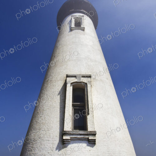 Low angle view of Yaquina Head Lighthouse, Newport, Oregon, United States Low angle view of Yaquina Head Lighthouse, Newport, Oregon, United States
