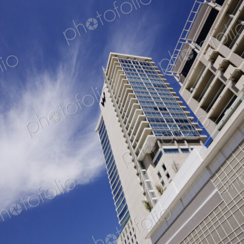 Low angle view of apartment building with parking lot. Low angle view of apartment building with parking lot.