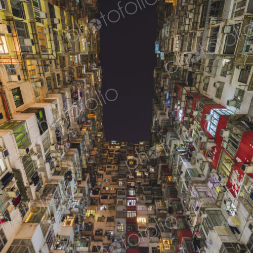 Low angle view of balconies and windows of Monster Building in Quarry Bay.