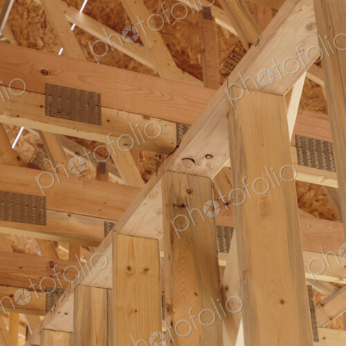 Low angle view of ceiling beams in new house
