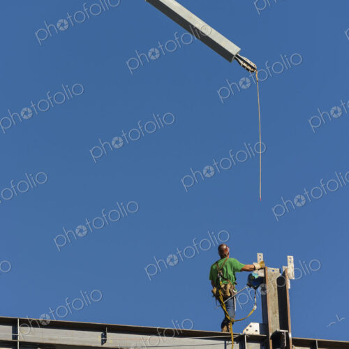 Low angle view of construction worker on scaffolding