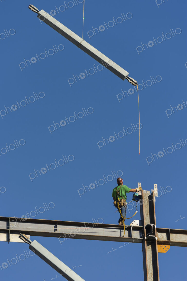Low angle view of construction worker on scaffolding