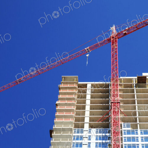 Low angle view of crane building highrise Low angle view of crane building highrise