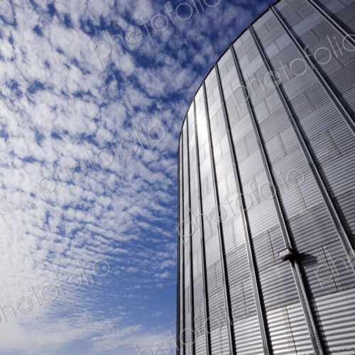 Low angle view of industrial building with metal grille.