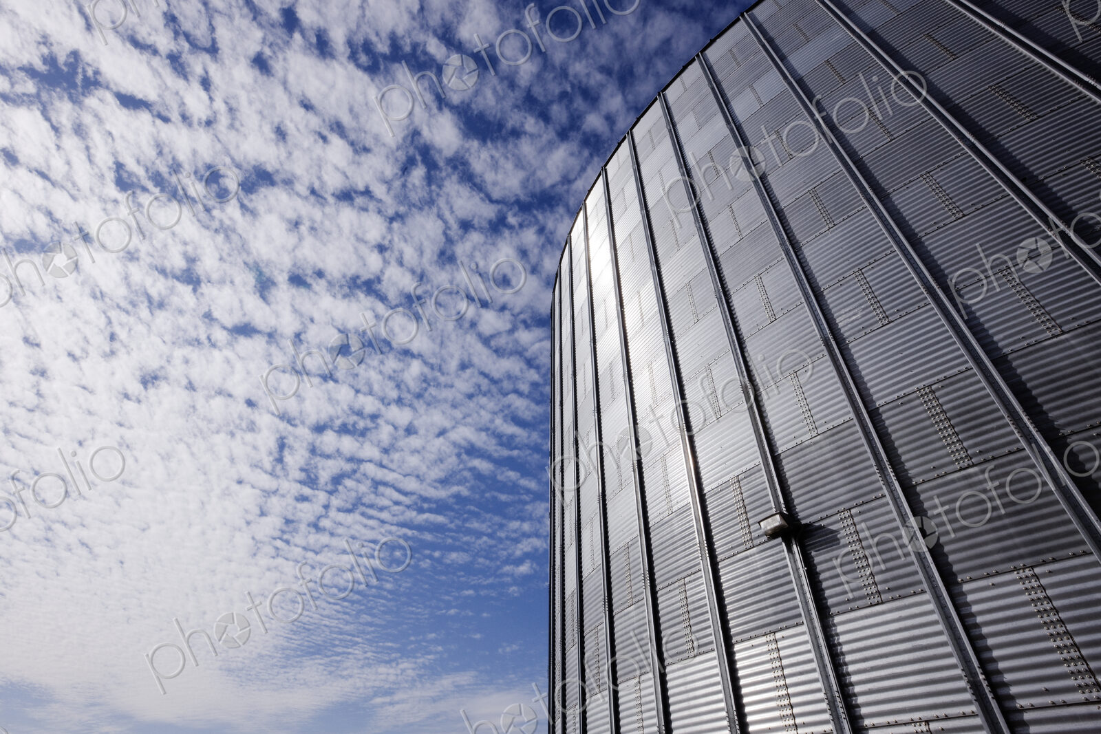 Low angle view of industrial building with metal grille.
