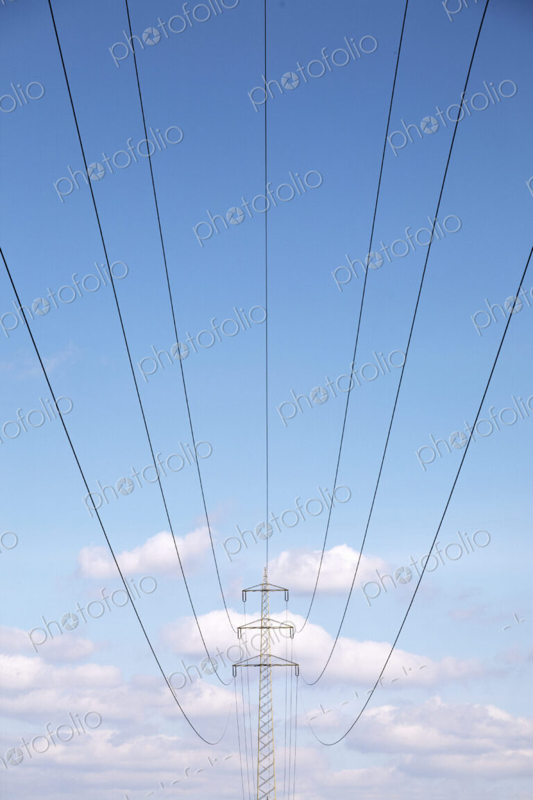 Low angle view of power lines under blue sky