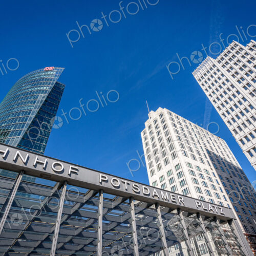 Low angle view of skyscrapers and entrance to Potsdamer Platz railway station, Berlin. Low angle view of skyscrapers and entrance to Potsdamer Platz railway station, Berlin.