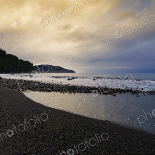 Low tide wilderness beach on the Strait of Juan de Fuca, Port Angeles, WA USA Low tide wilderness beach on the Strait of Juan de Fuca, Port Angeles, WA USA