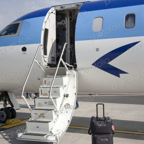 Luggage Near Airplane Steps