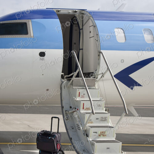 Luggage Near Airplane Steps