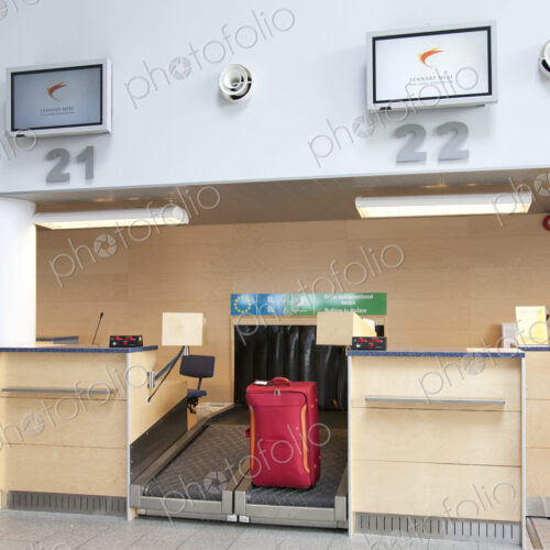 Luggage at an Airline Check-In Counter Luggage at an Airline Check-In Counter