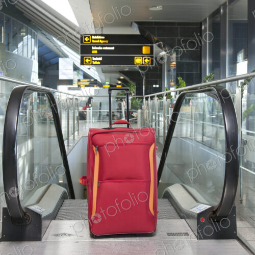 Luggage at the Top of an Escalator Luggage at the Top of an Escalator