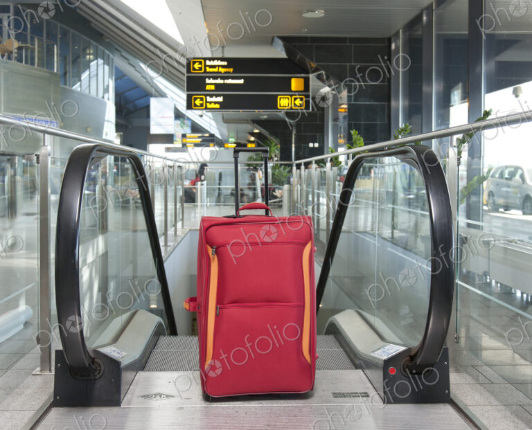Luggage at the Top of an Escalator