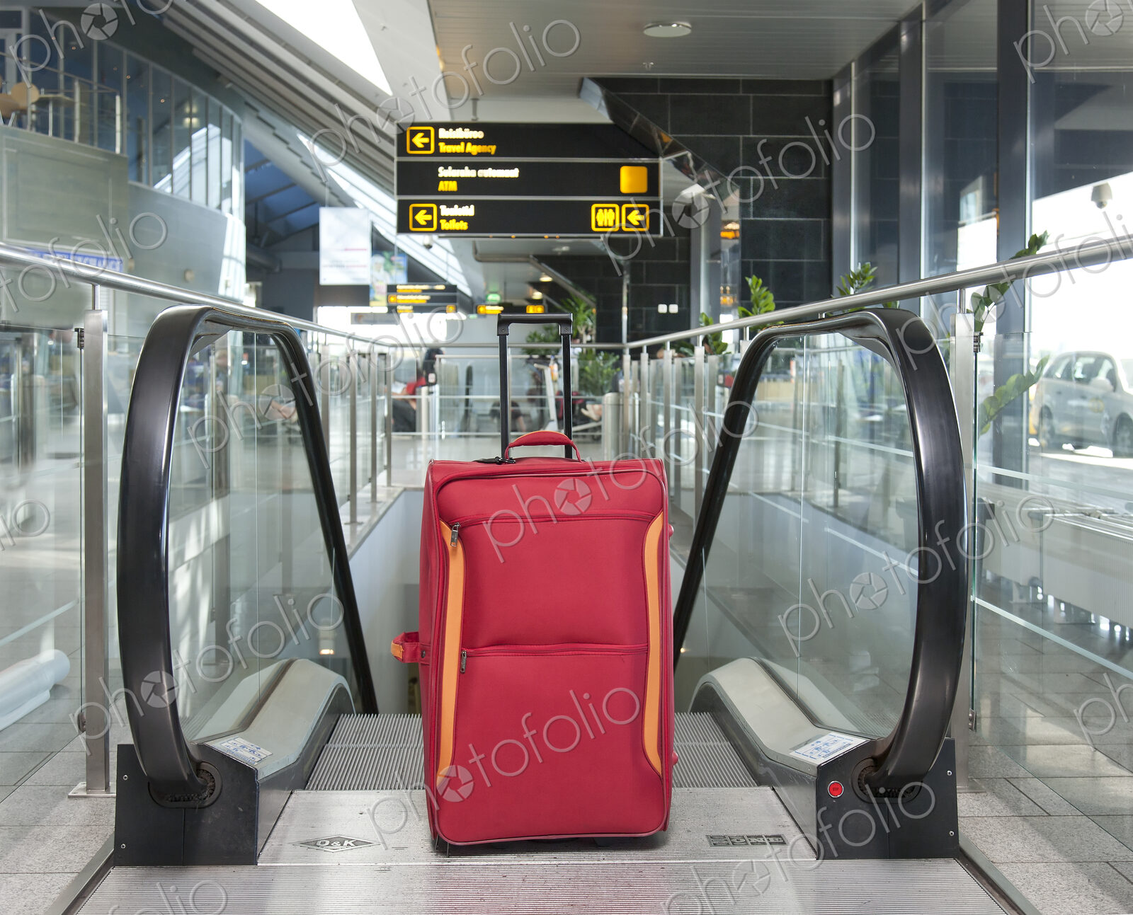 Luggage at the Top of an Escalator