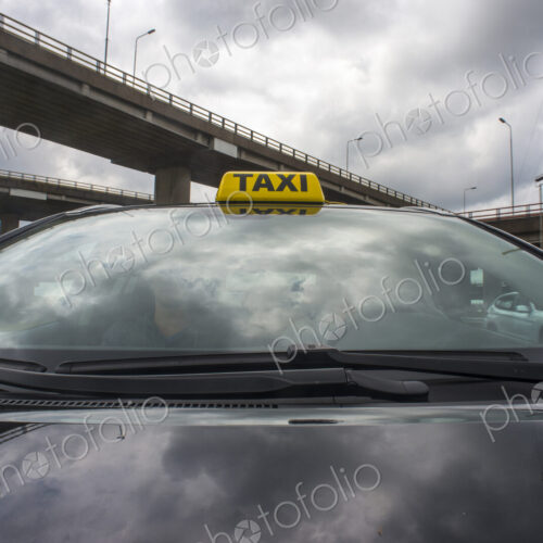 Luxurious car with a taxi sign on its roof. Luxurious car with a taxi sign on its roof.