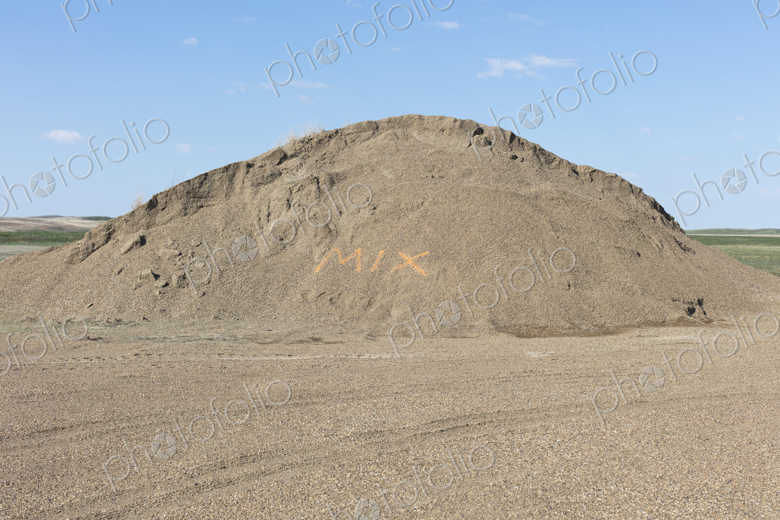 “MIX” spray painted on gravel pile, near Scotsguard, Saskatchewan, Canada.