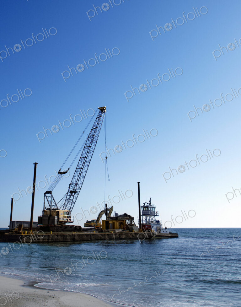 Machinery Cleaning Up a Pier