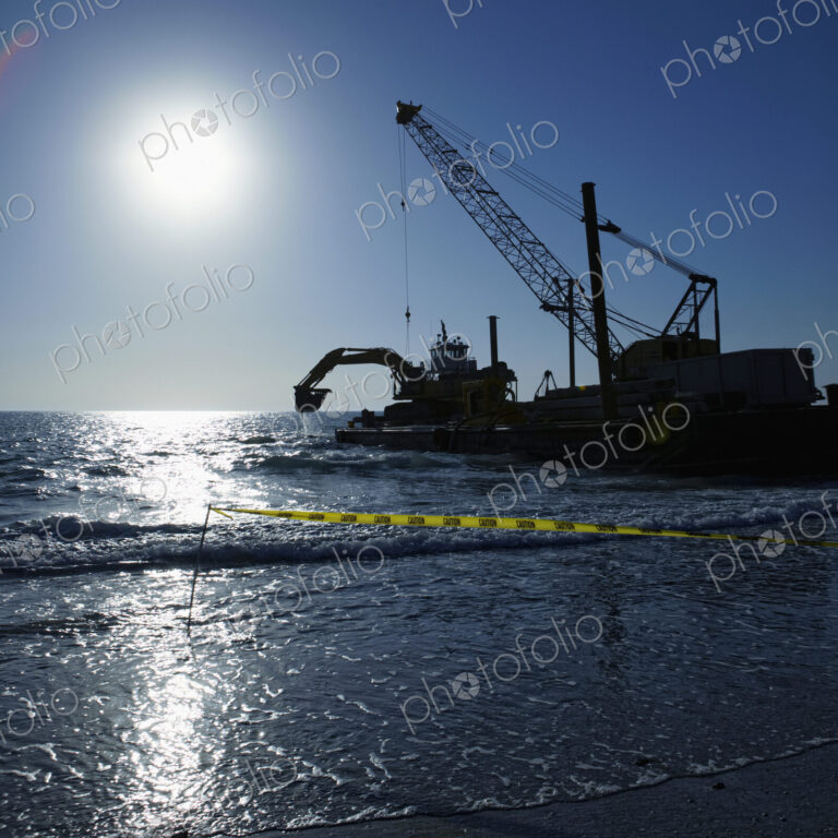 Machinery Cleaning Up a Pier