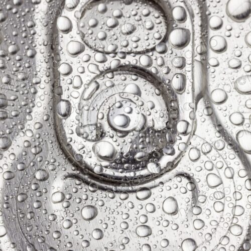 Macro view of water droplets covering the top of a sealed aluminum beverage can. Cold,…
