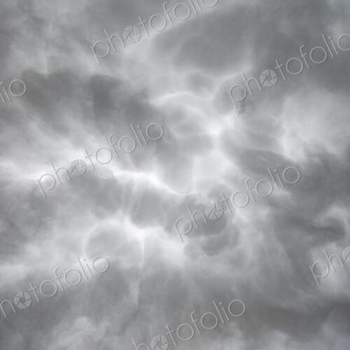 Mammatus Clouds in the sky, grey and white clouds shaped by weather. Mammatus Clouds in the sky, grey and white clouds shaped by weather.