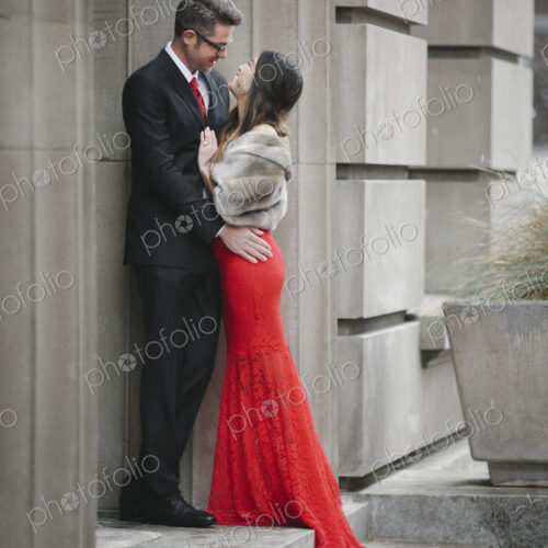Man and woman, couple in evening dress outside in a city Man and woman, couple in evening dress outside in a city