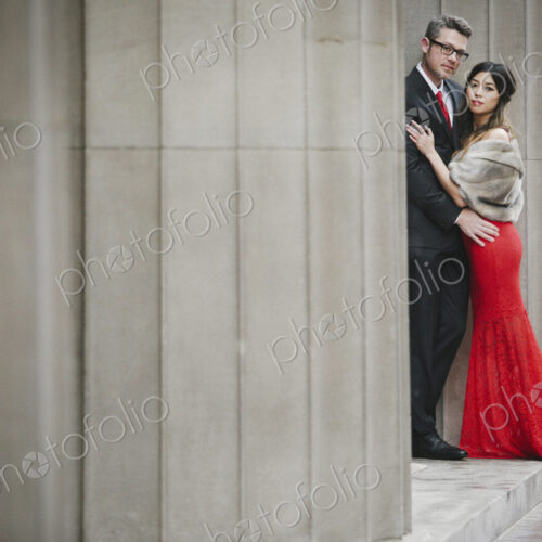 Man and woman, couple in evening dress outside in a city