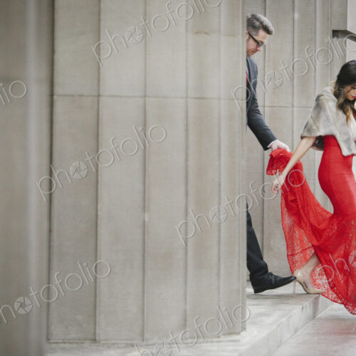 Man and woman, couple in evening dress outside in a city Man and woman, couple in evening dress outside in a city