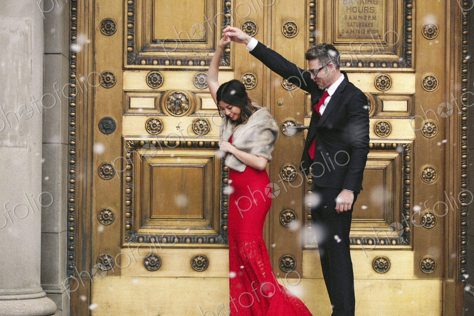 Man and woman, couple in evening dress outside in a city